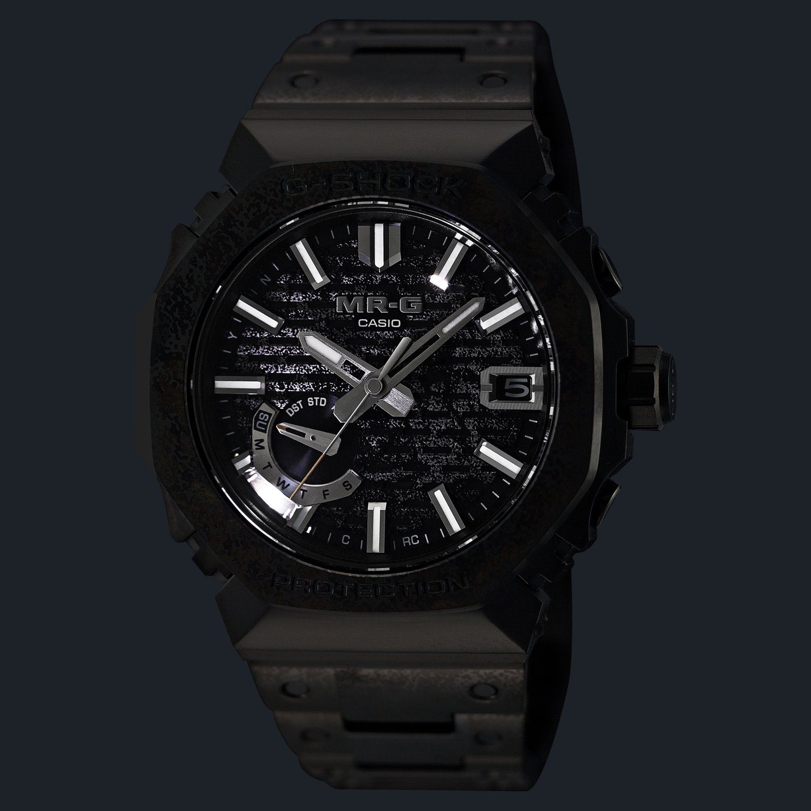 The G-Shock MRG-B2100HR-1A in the dark with its white LED light on