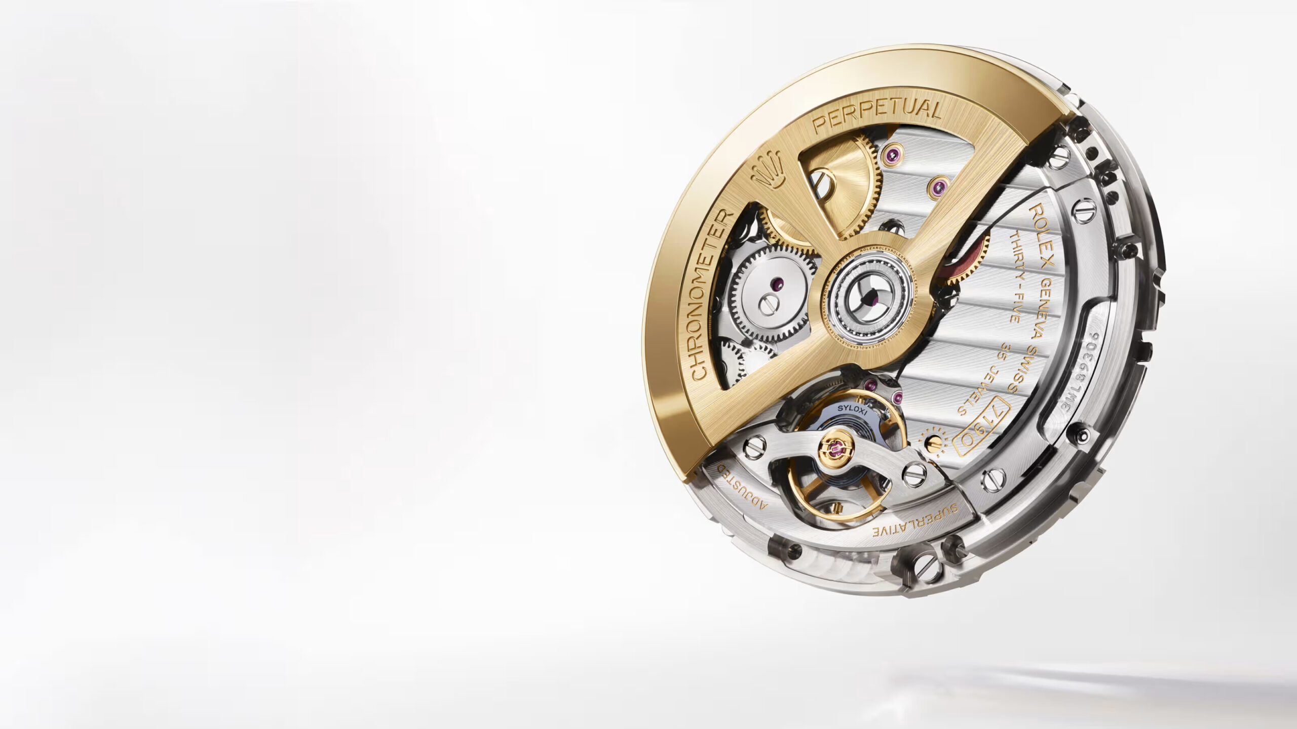 Rolex calibre 7190 showing the gold rotor engraved Perpetual, the 35 jewels marking and the Syloxi hairspring