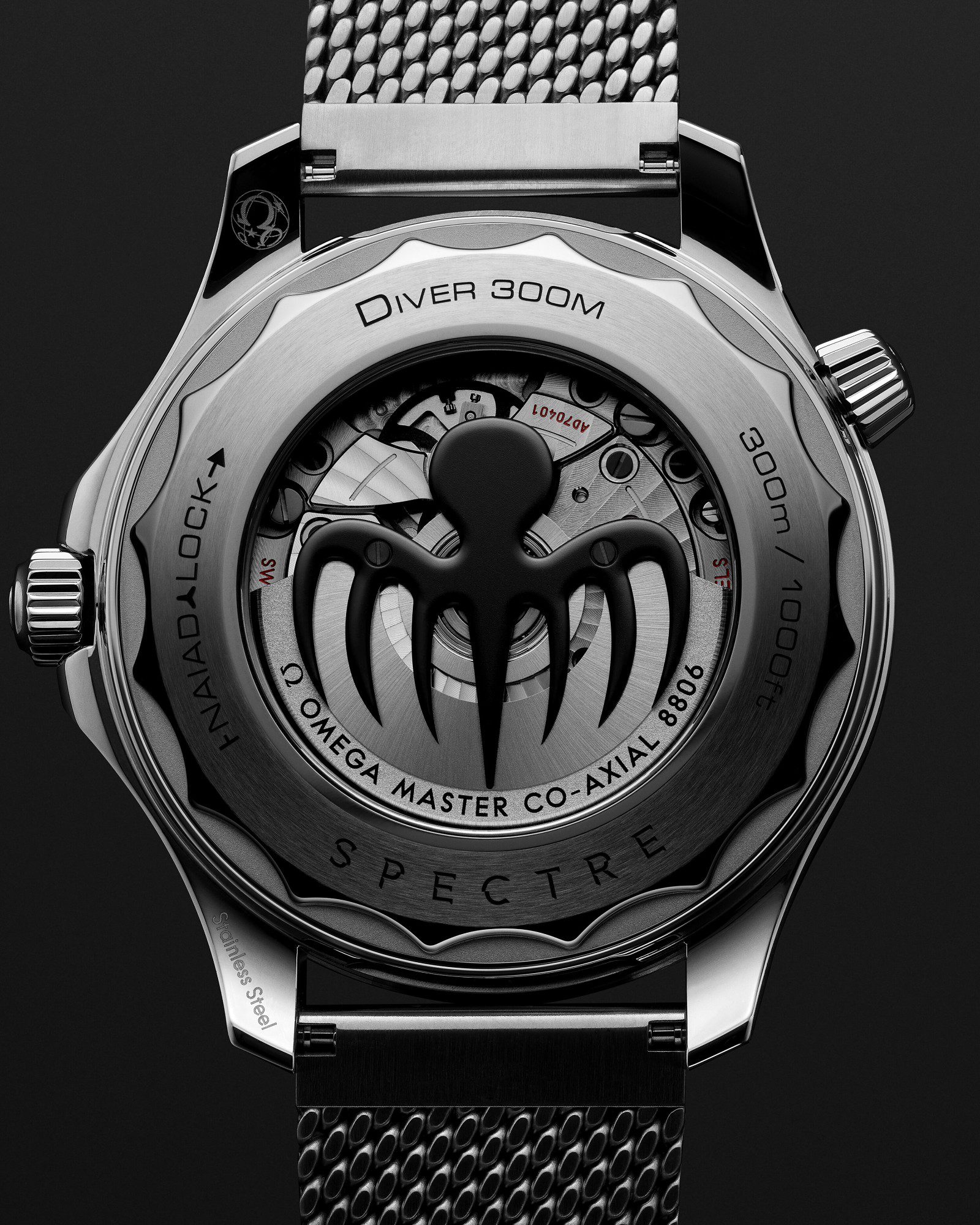 The sapphire caseback of the Omega Seamaster Diver 300M SPECTRE Edition showing the blackened octopus rotor