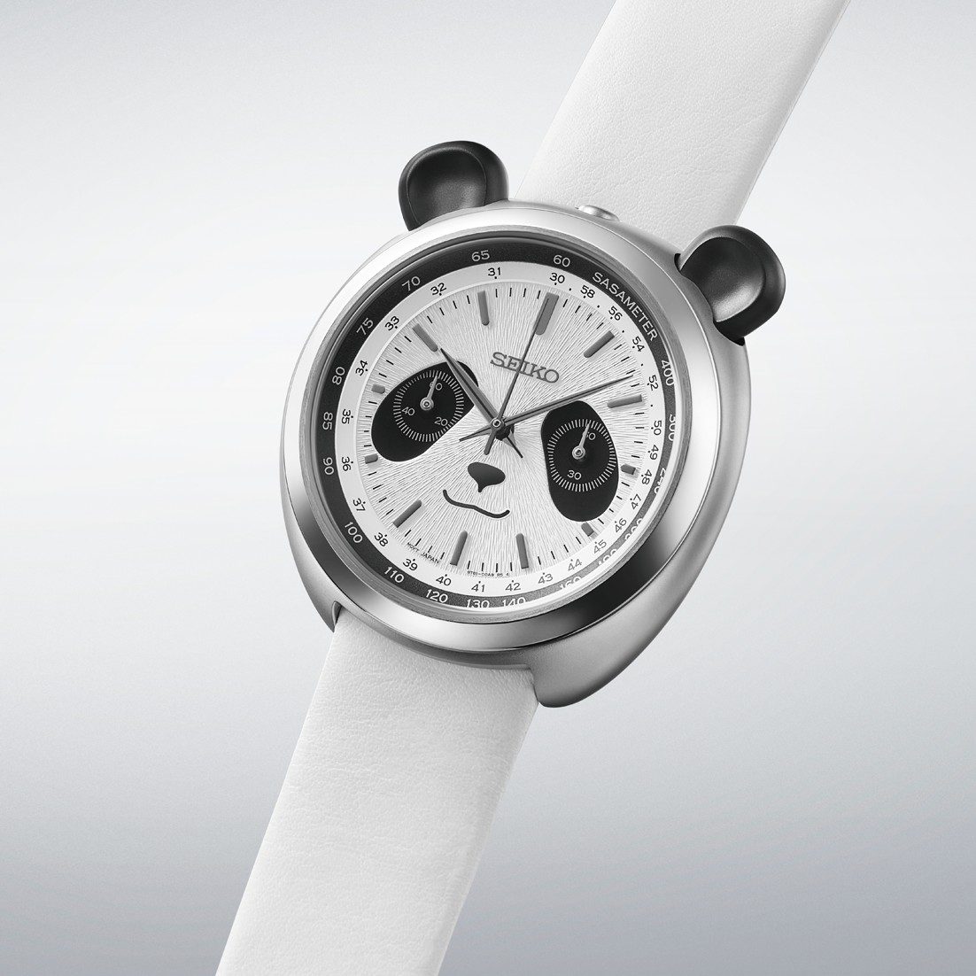 Angled view of the Seiko Panda Chronograph HHK001 showing the ear-shaped pushers at 11 and 1 o'clock and the Sasameter scale